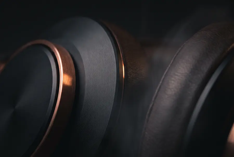 Macro detail of NOCTIS materials: black ear-cup edge, copper hinge, and leather.